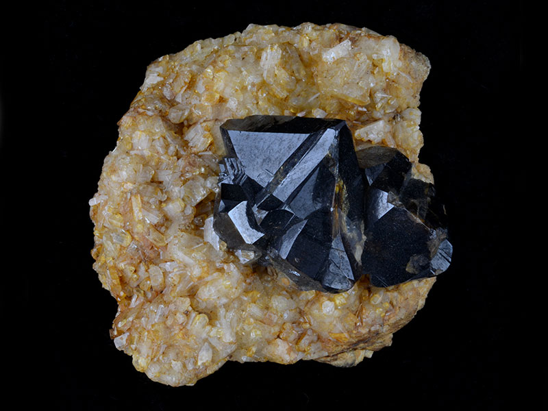 Cassiterite on topaz, specimen 4 cm across