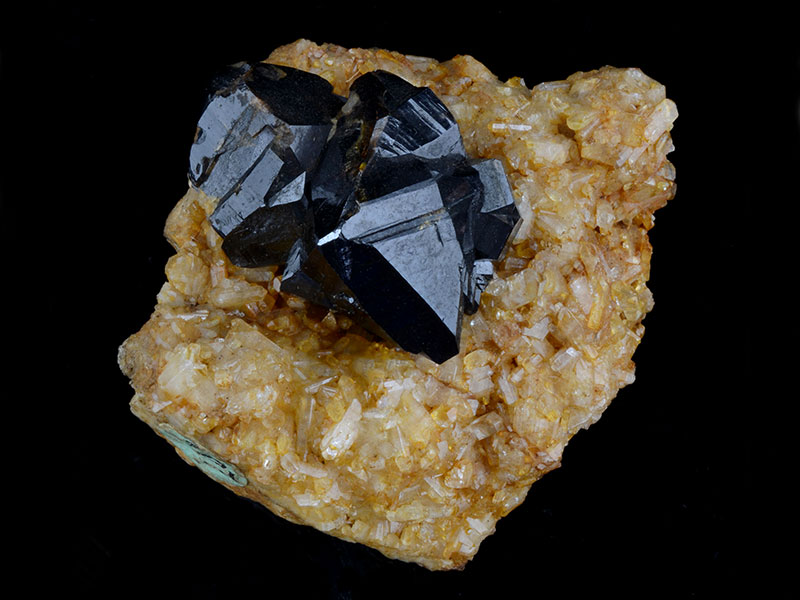 Cassiterite on topaz, specimen 4 cm across