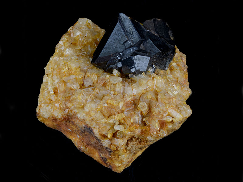 Cassiterite on topaz, specimen 4 cm across